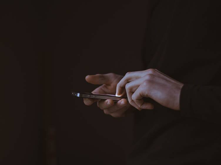 A person using a mobile phone