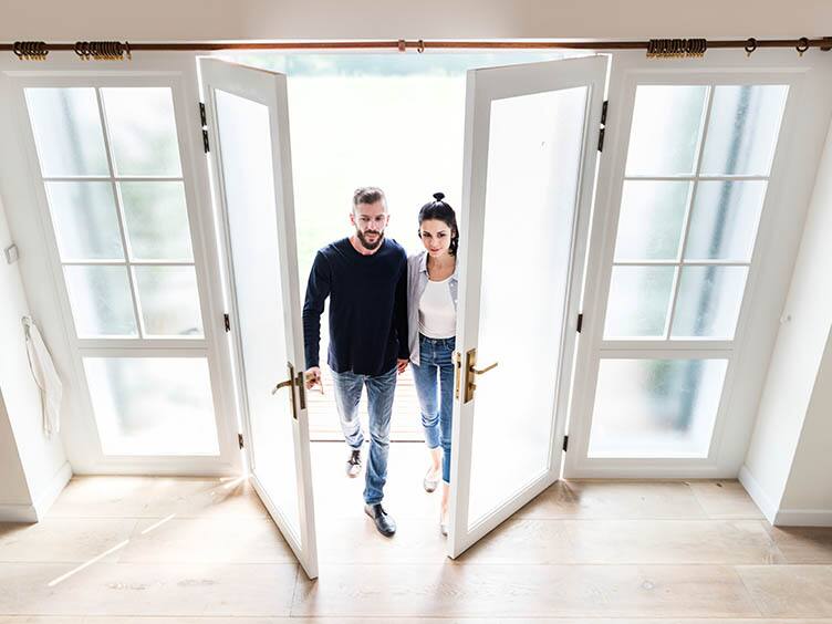 A couple entering the house