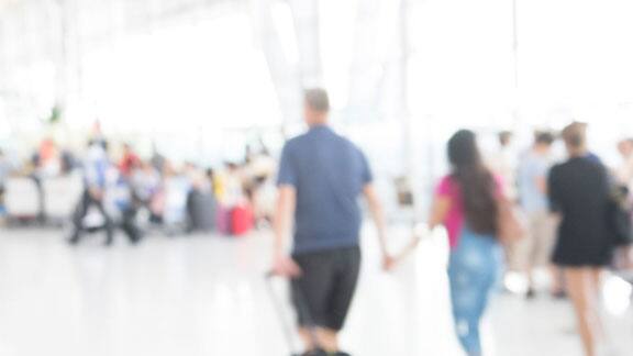 Blurred image of people walking outdoors